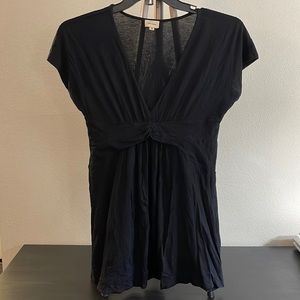 Ella Moss top with tapered waist.